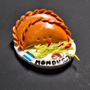 Iman de pastelito de perro